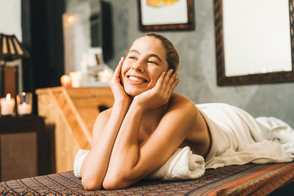 Lymphatic Drainage Massage Downtown Brooklyn: A happy, relaxed client sitting up after a massage session, looking energized and balanced.